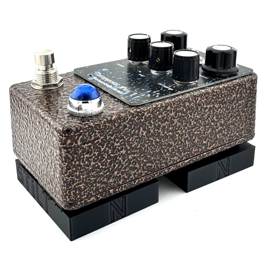The STILT Pedal Riser from Nicholls Custom Designs being used to give lift to an Antagonistic Fuzz from The Sound Of Justice