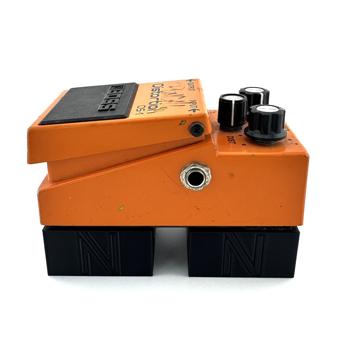 The XL STILT Pedal Riser from Nicholls Custom Designs being used to give lift to a Boss DS-1